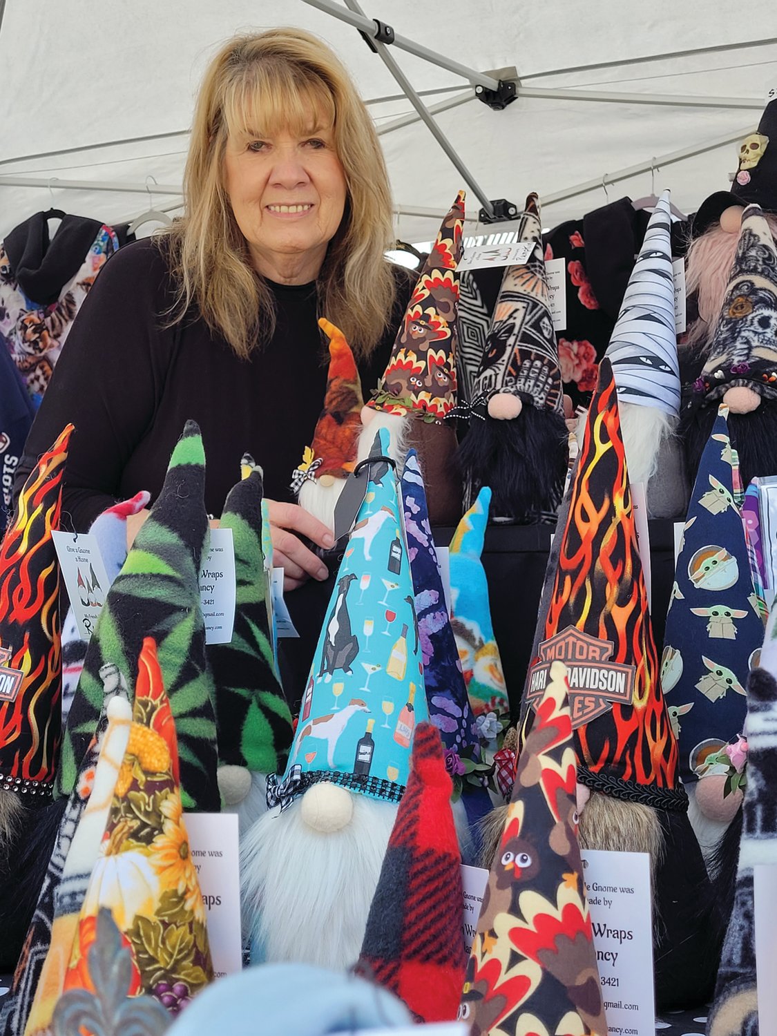 GNOME SWEET GNOME: Nancy Howlett designs “Fashion Wraps” and sold a variety of gnomes just inside the entrance to the Apple Festival.